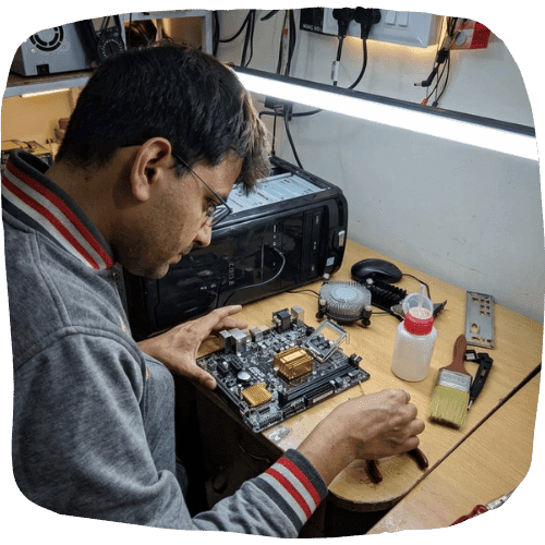 LapDesk technician repairing a laptop motherboard